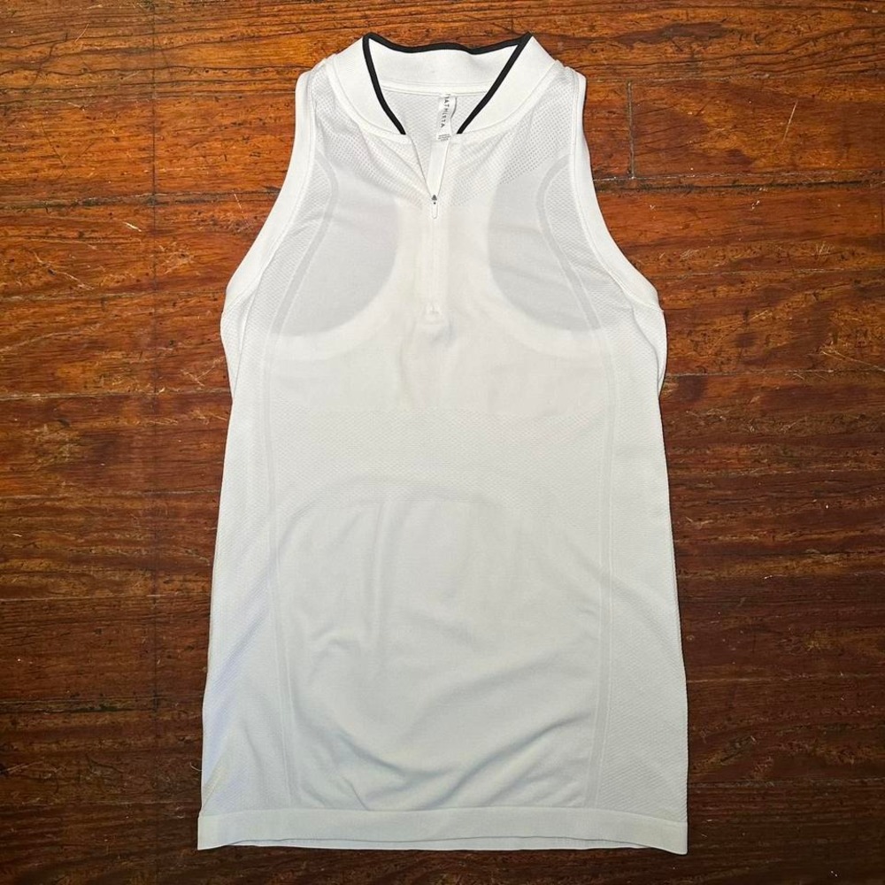 Athleta white sleeveless performance top with a half-zip neckline